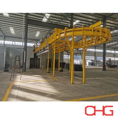 Custom engineered power and free conveyor system providing material flow and flexible transportation in coating production